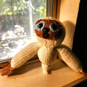 Handknitted ghost sloth